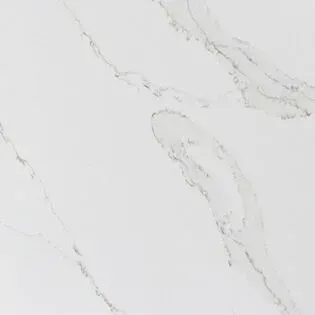 A close up of a white marble counter top.
