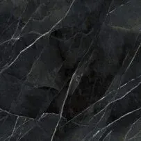 A close up of a black marble tile with white veins.