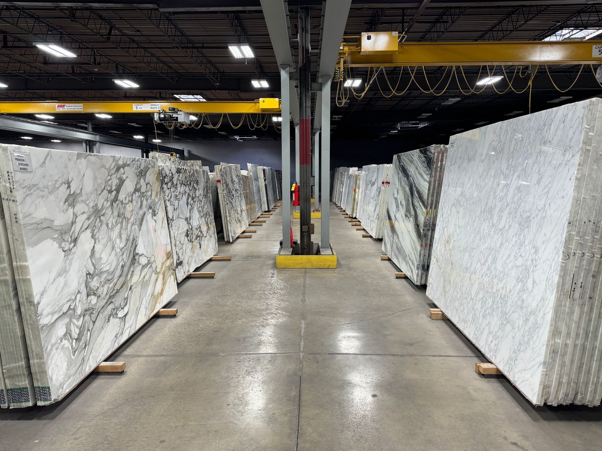 A warehouse filled with lots of white marble slabs