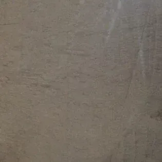 A close up of a gray tile with a grainy texture.