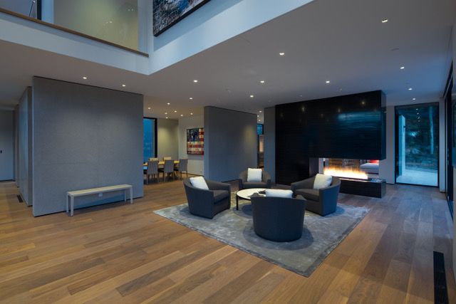 There is a fireplace in the middle of the living room.