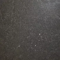 A close up of a black granite counter top.