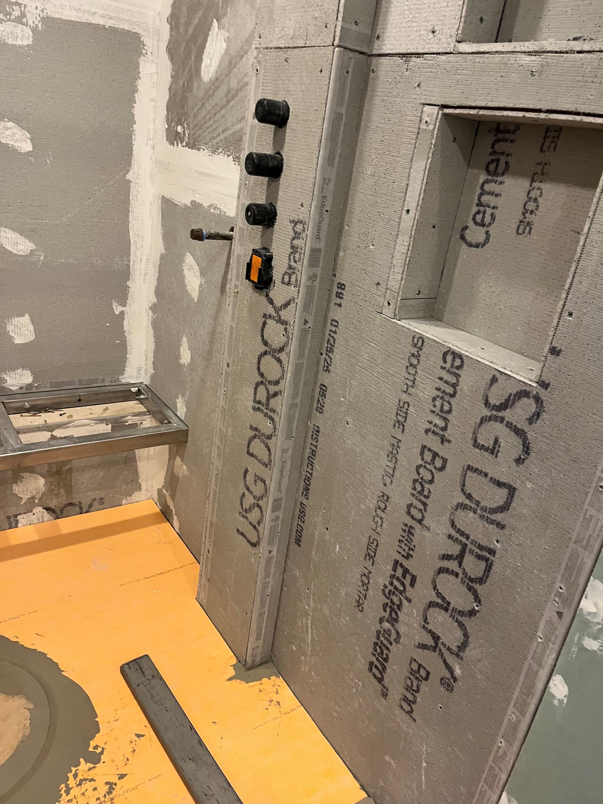 A bathroom being remodeled with a sg durarock board
