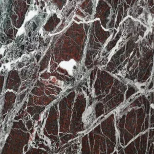 A close up of a red and white marble texture.