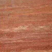 A close up of a red marble tile.