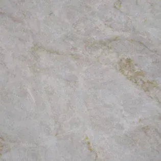 A close up of a white marble counter top.