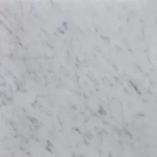 A close up of a white marble counter top.