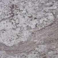 A close up of a white granite counter top.