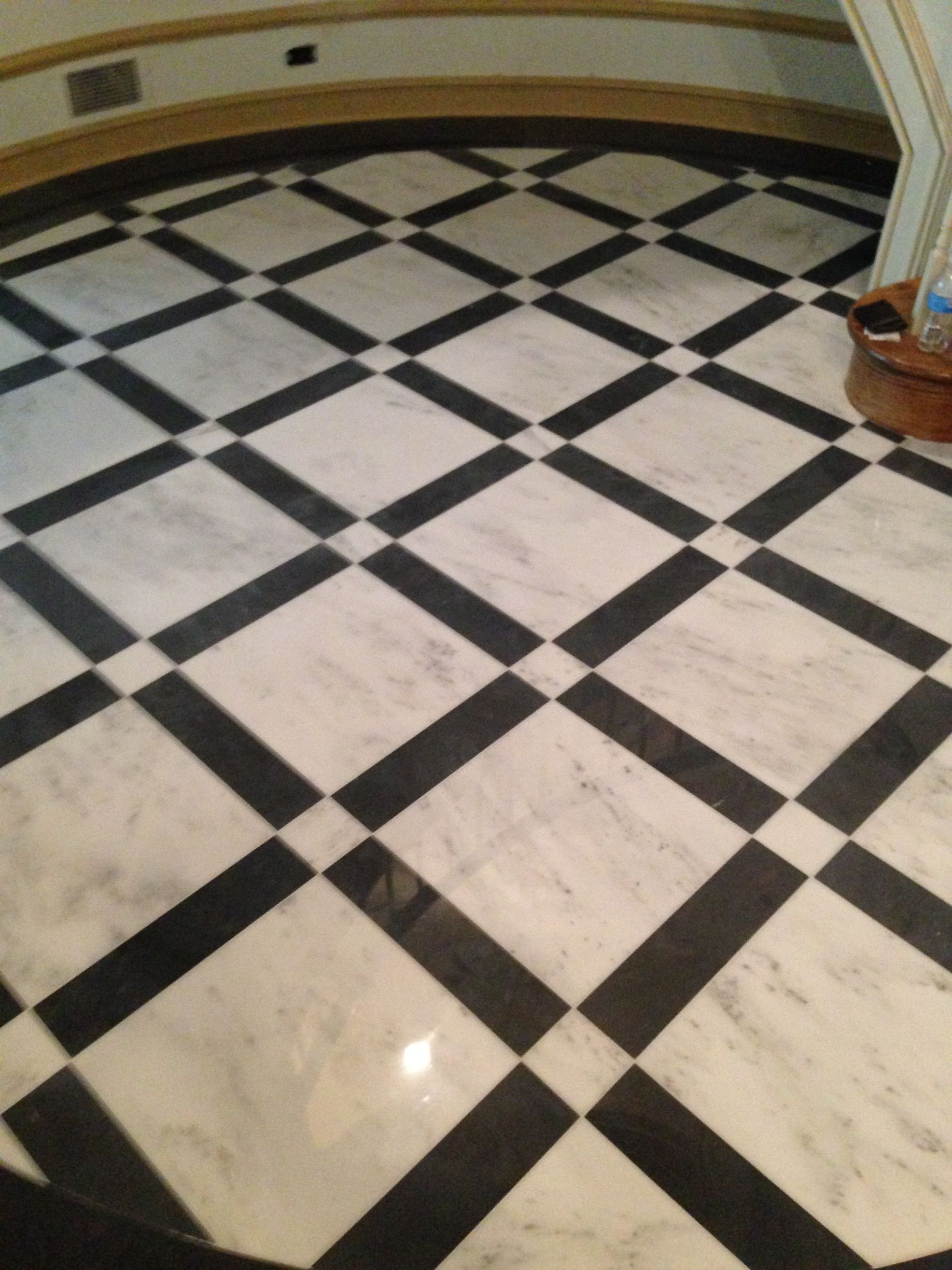 A black and white checkered floor in a room