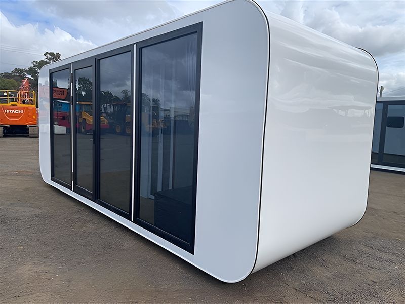A White Portable House With Black Windows — NQ Trading in Townsville, QLD