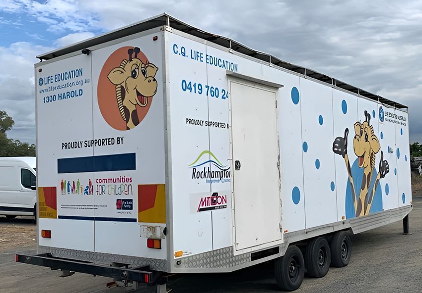 A White Trailer With a Giraffe on the Side — NQ Trading in Brisbane, QLD