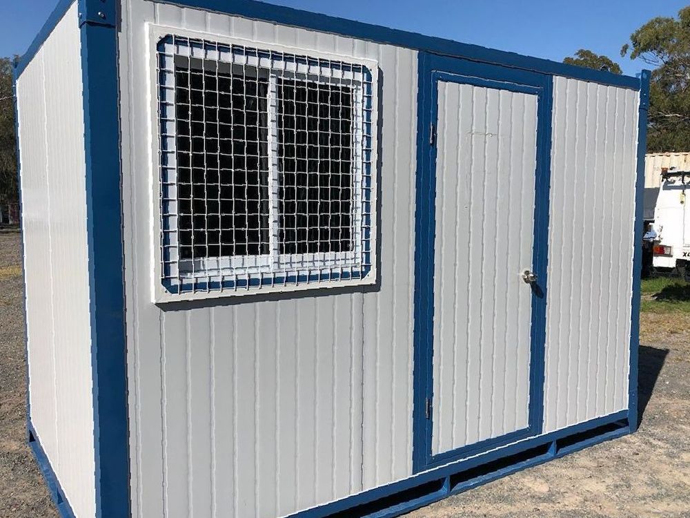 A White and Blue Container With a Window and a Door — NQ Trading in Townsville, QLD