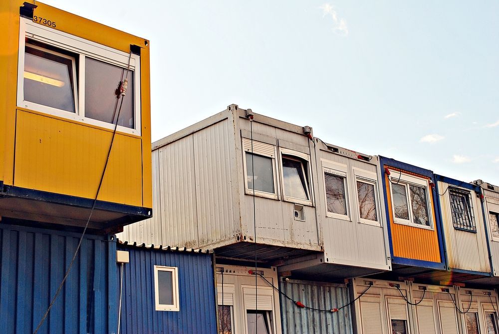 A Row of Shipping Containers Are Sitting Next to Each Other — NQ Trading In Edmonton, QLD