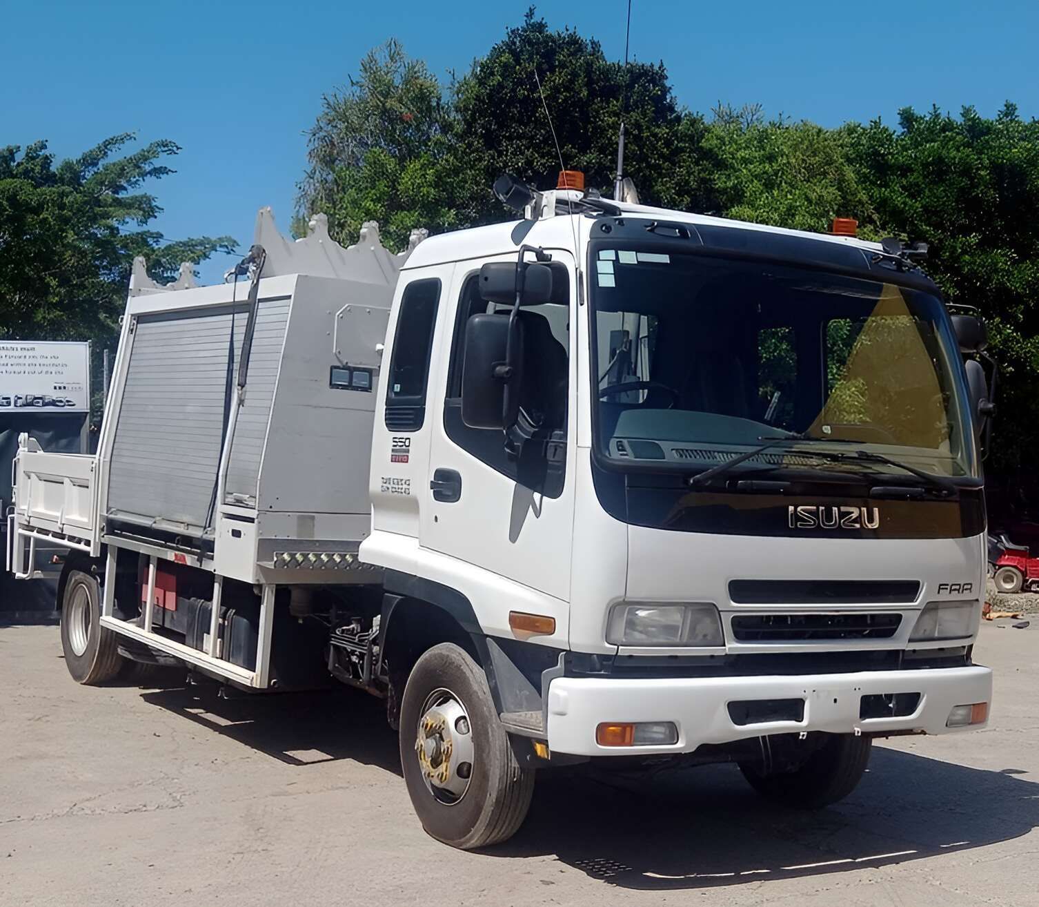 A White Isuzu Truck Is Parked In A Parking Lot — NQ Trading In Edmonton, QLD
