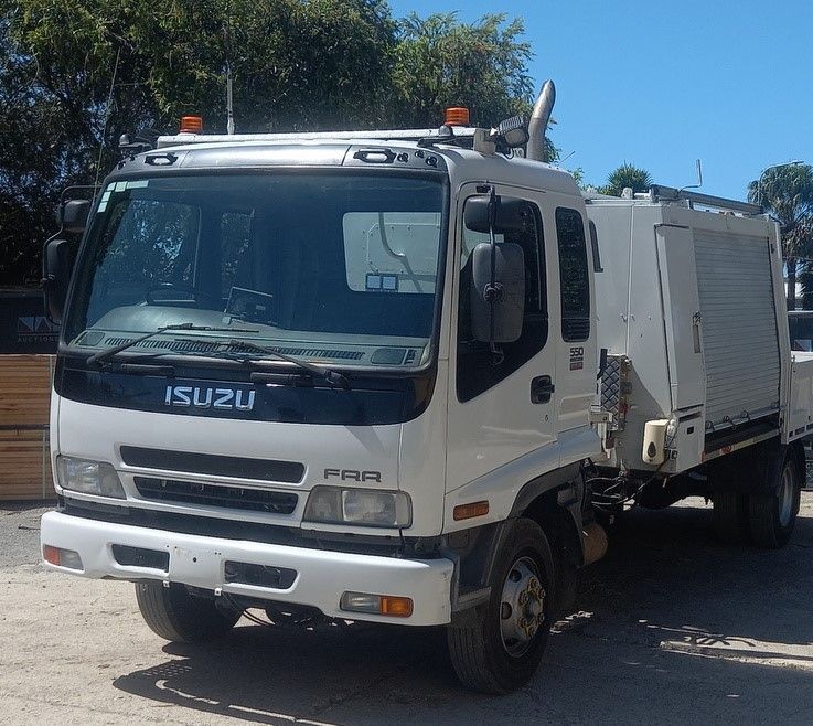 A White Isuzu Truck is Parked — NQ Trading in Brisbane, QLD