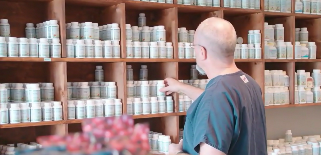 Michael Norris Holding Bottle — Knoxville, TN — Deep River Wellness Center