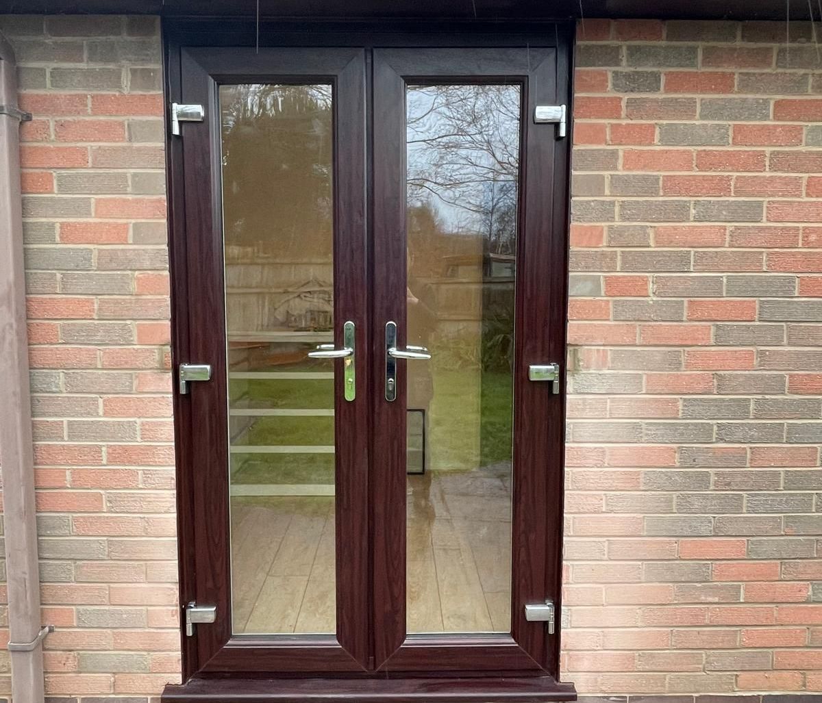 A brick building with a brown door on it