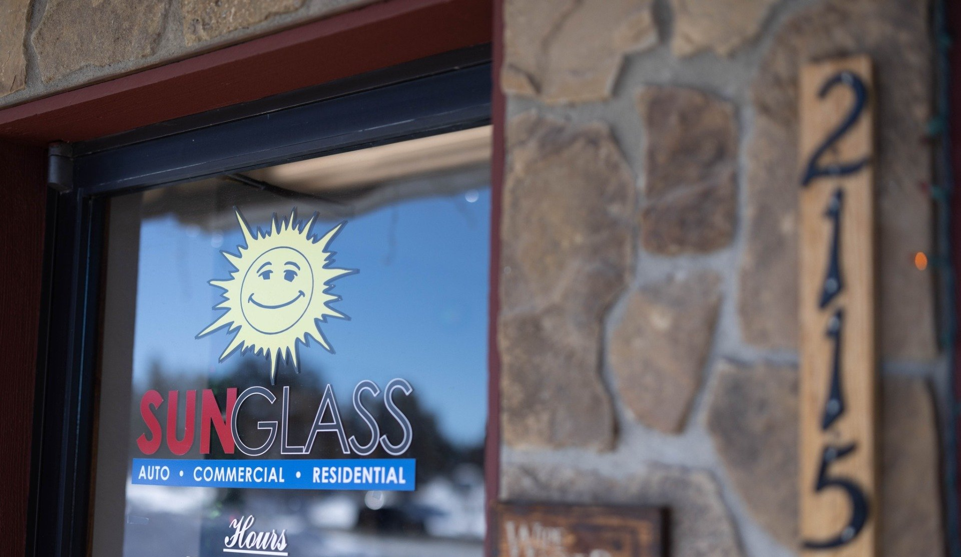 a sign for sunglass auto commercial and residential