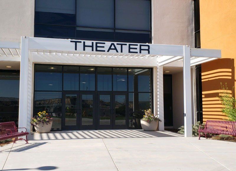 A theater building with windows installed by Sunglass