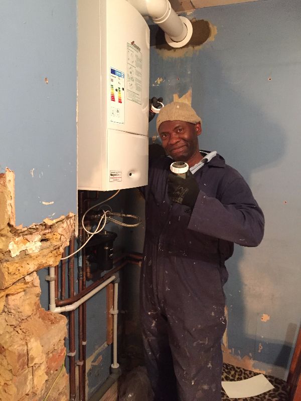 engineer fixing a heating system