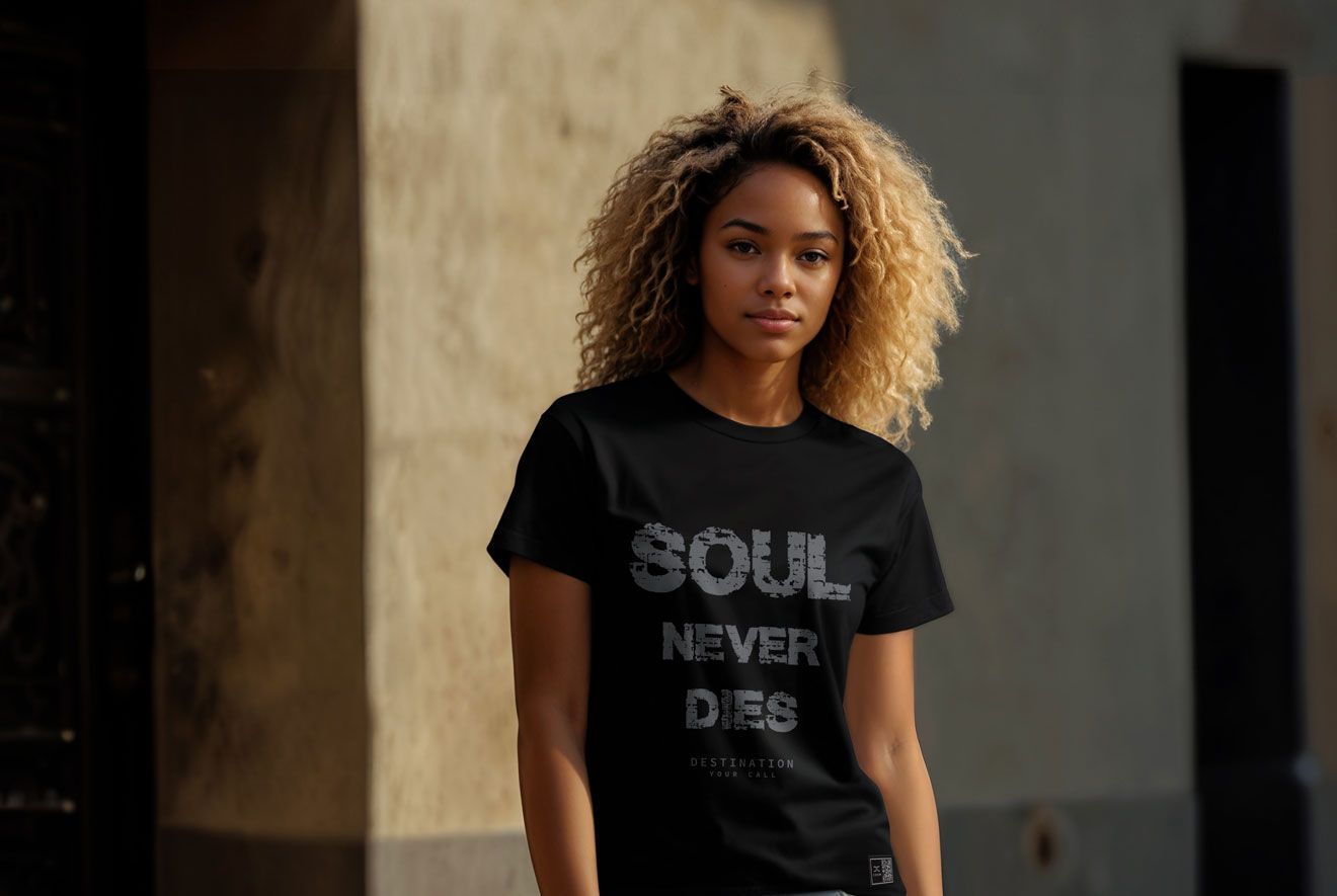 Woman with curly blonde hair wearing a black t-shirt that says 