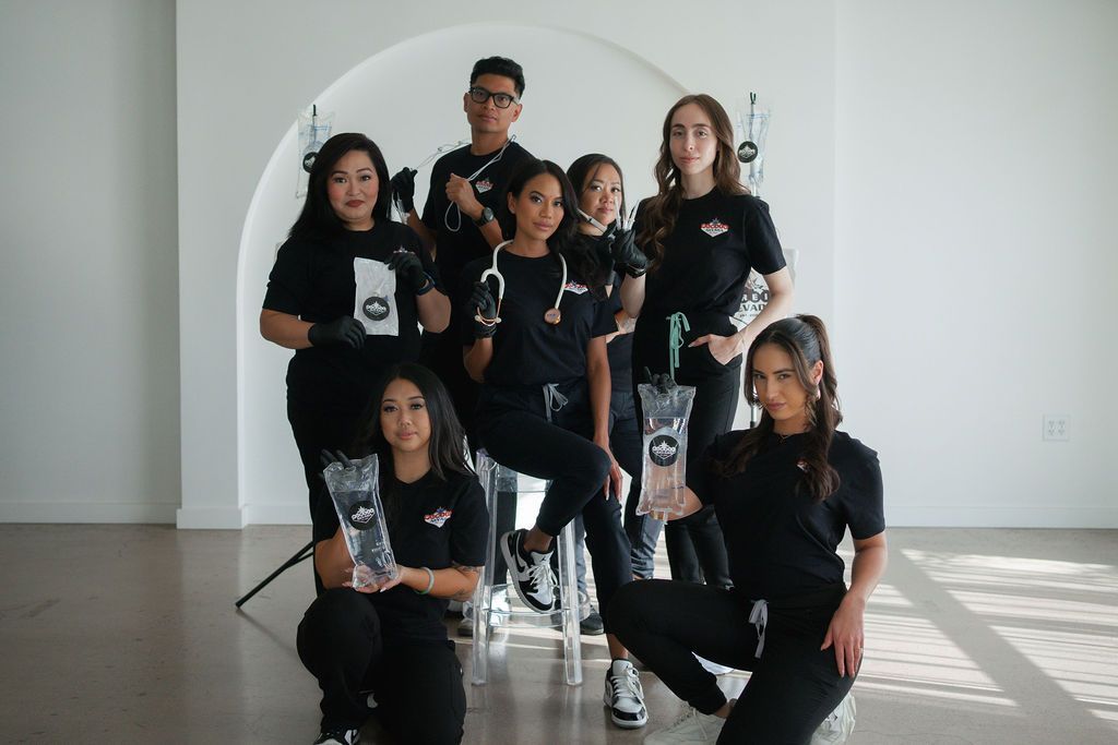 A group of people are posing for a picture in a room.