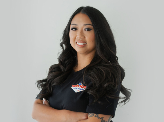 A woman wearing a black shirt with a logo on it