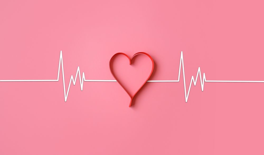 A heart made out of a heartbeat line on a pink background.