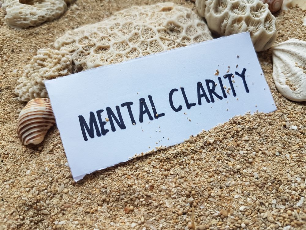 A piece of paper with the words mental clarity written on it