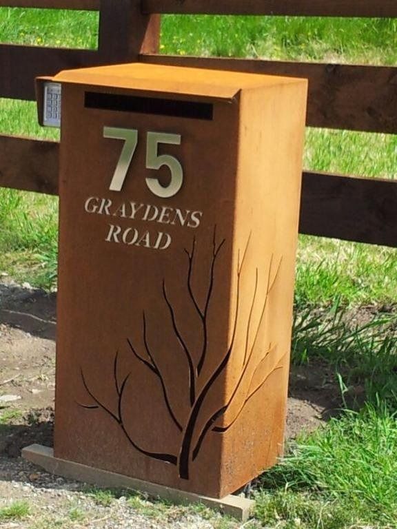 A mailbox with the number 75 on it