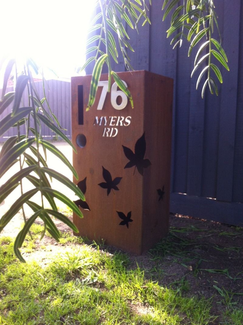 A mailbox with the number 76 on it