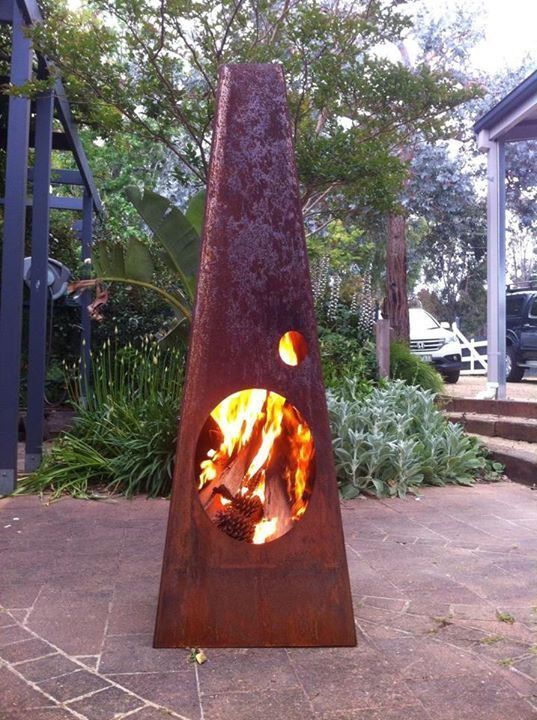 A fire pit with a hole in the middle of it