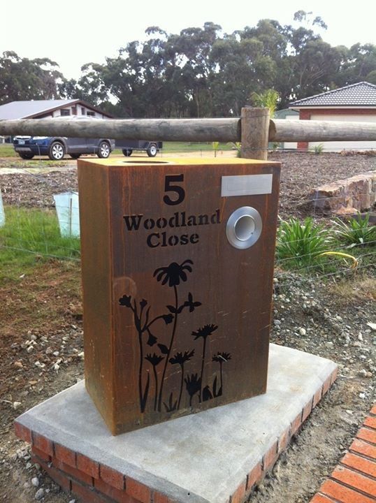 A mailbox with the number 5 woodland close on it