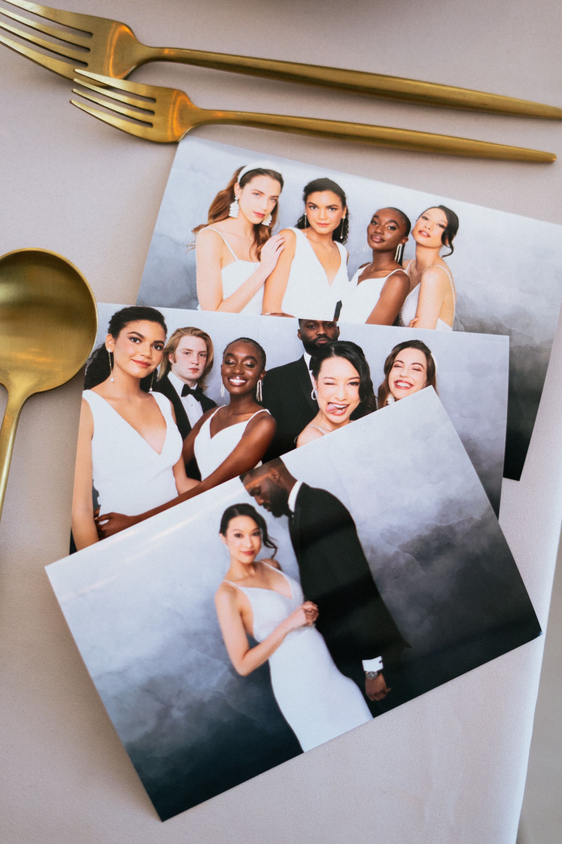 Guests posing with Booth Be Told photo prints at a celebration coordinated by local event planners