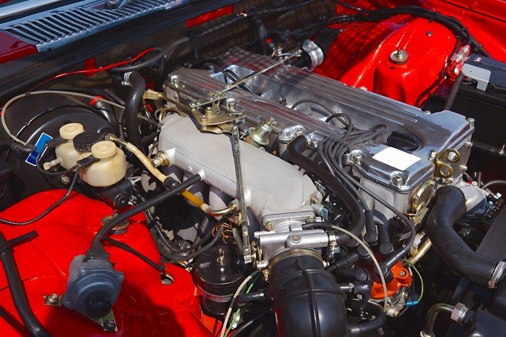 A Close Up of a Red Car Engine — Forster Mechanical Repairs & Servicing In Forster, NSW