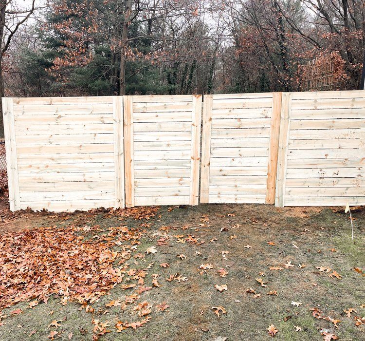 Renegade Fences & Farm High Quality backyard wood fencing design.
