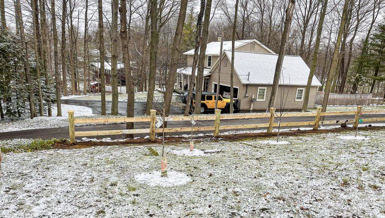 Durable wood railing farm fencing services.