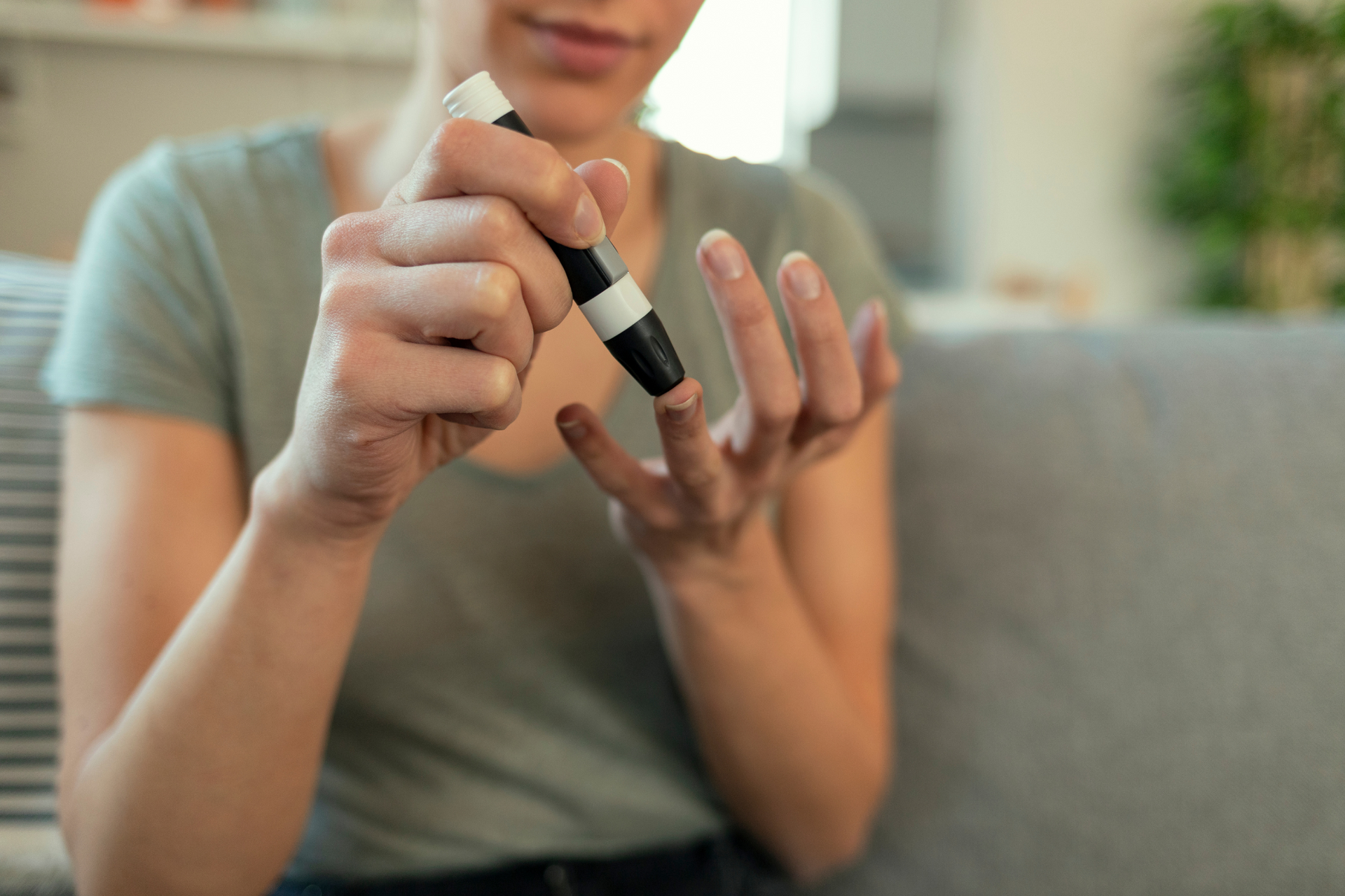 A woman is trying out at-home food allergy testing through skin pricking and sending them to a lab.