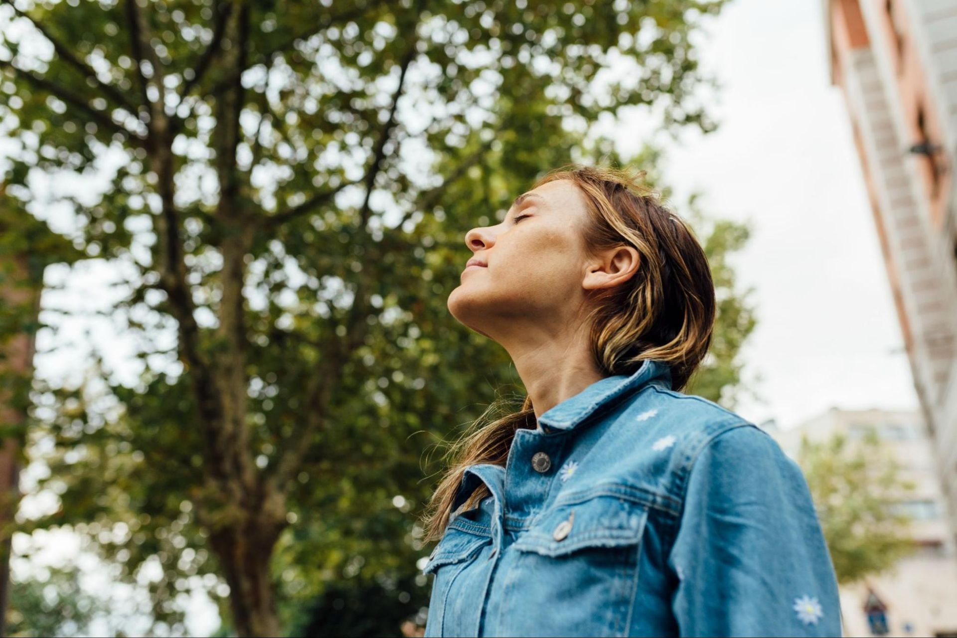 A woman enjoys the fresh air outdoors after visiting an allergy clinic in South Tampa.