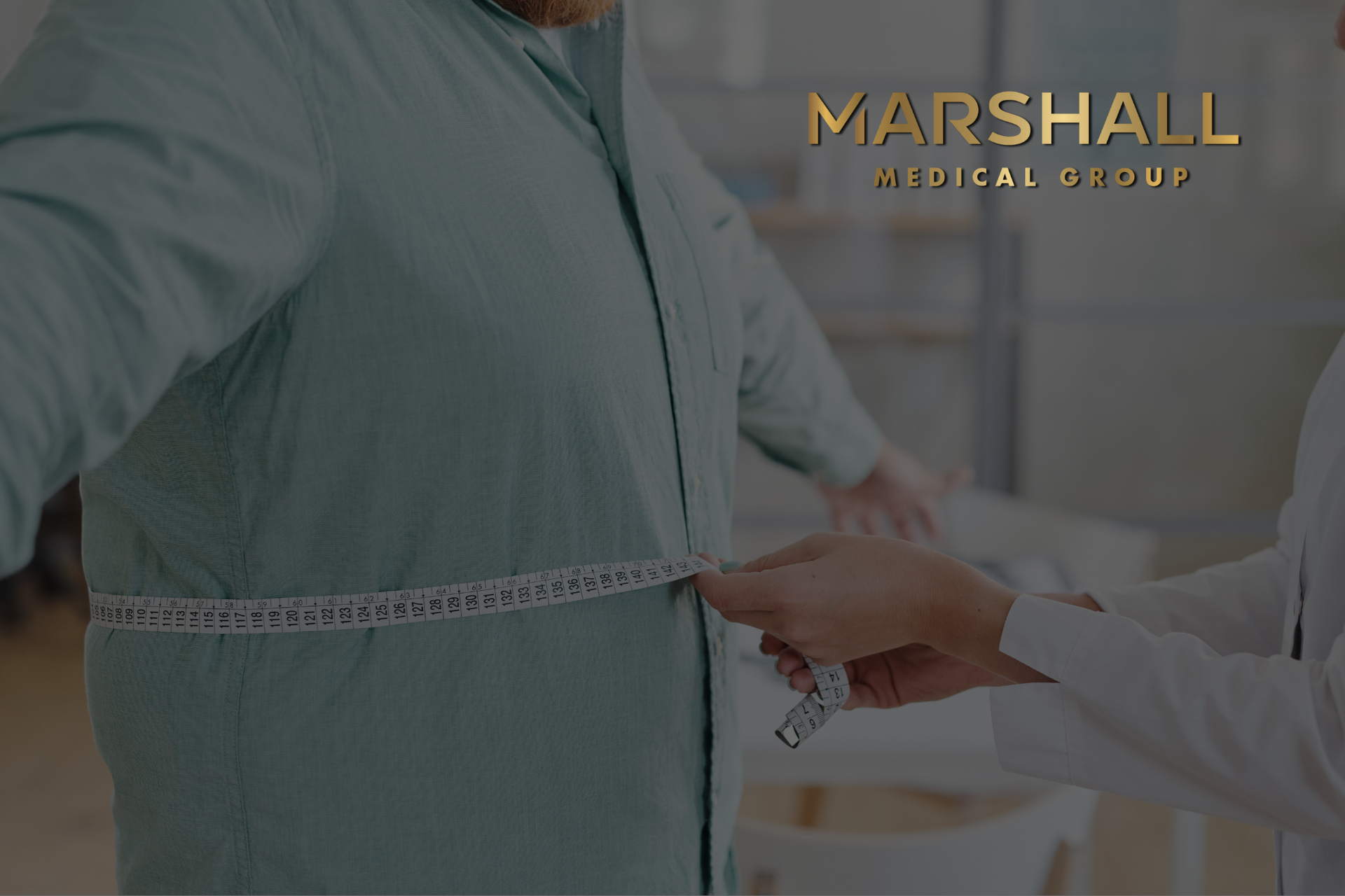 Doctor measuring waist of overweight man during his visit to a weight loss clinic in Kentucky. 