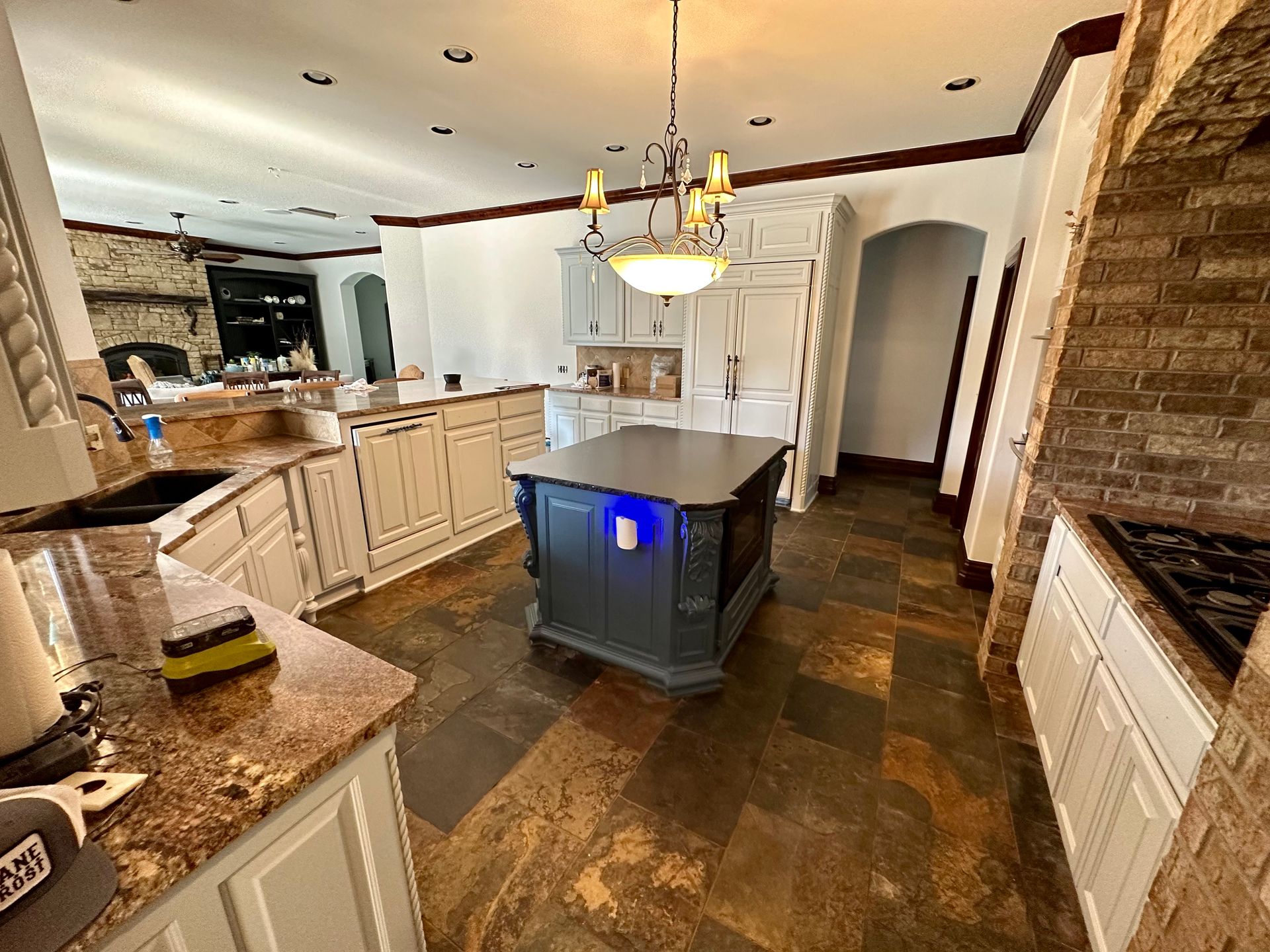 A kitchen with a large island in the middle of it.
