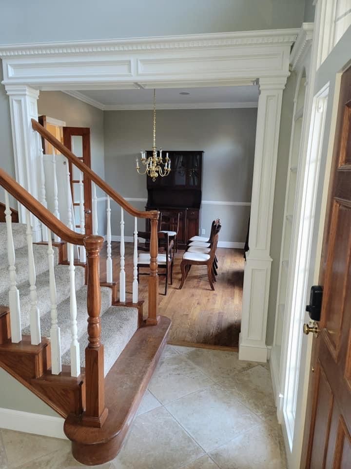 A staircase leading up to a dining room in a house.