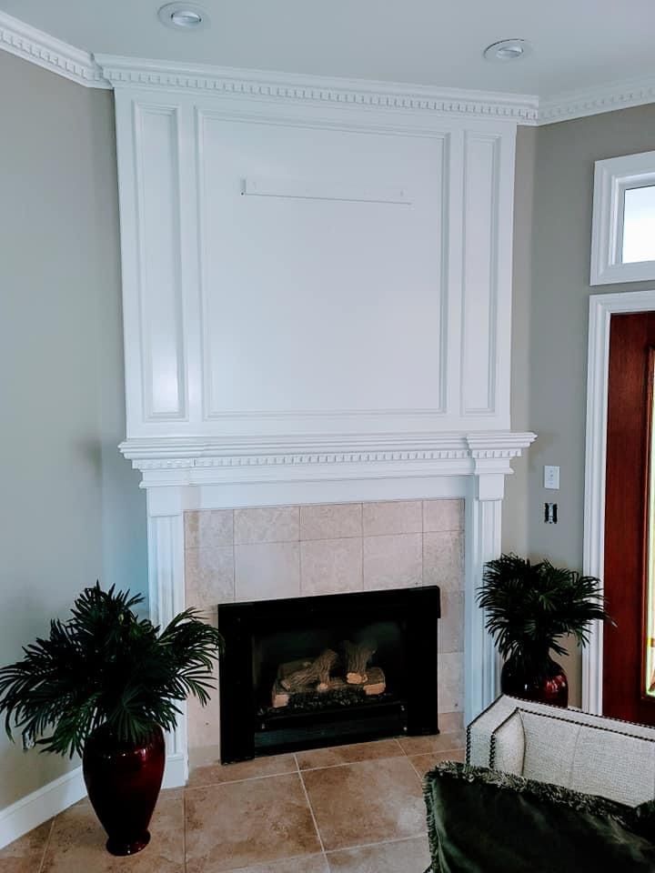 A living room with a fireplace and a couch