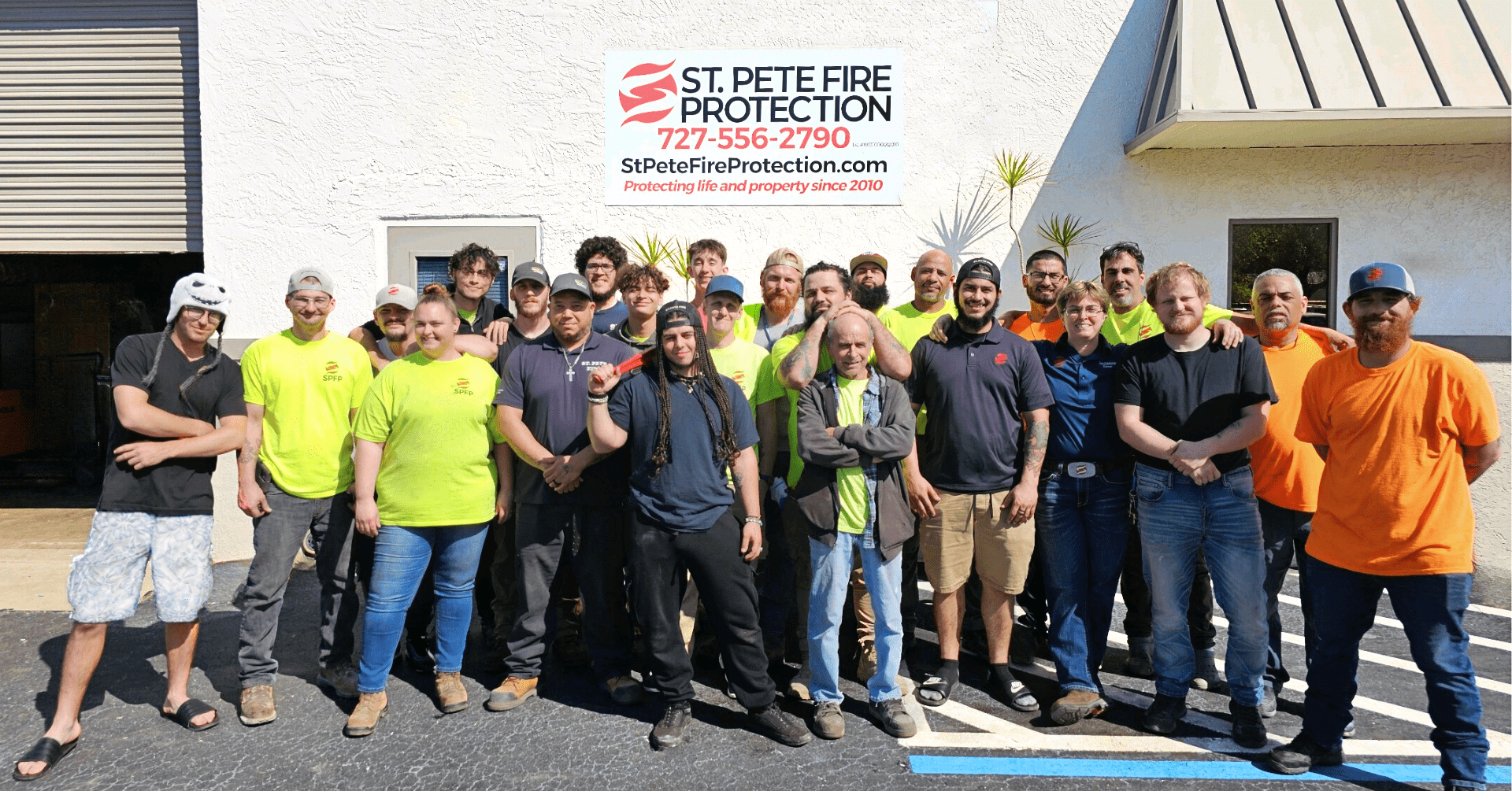 St. Pete Fire Protection employees standing outside our offices