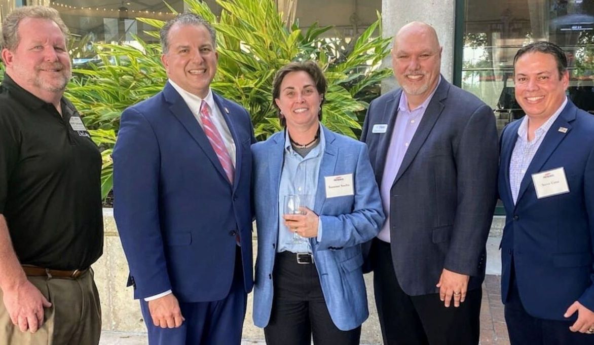 Owner Suzanne Saults poses with fellow fire protection members