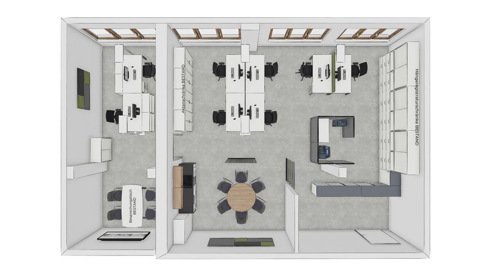 Draufsicht auf ein Büro mit Schreibtischen, einem Besprechungstisch und einer Küchenzeile.