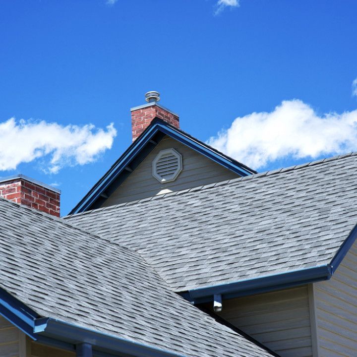 The roof of a house with a chimney on top of it