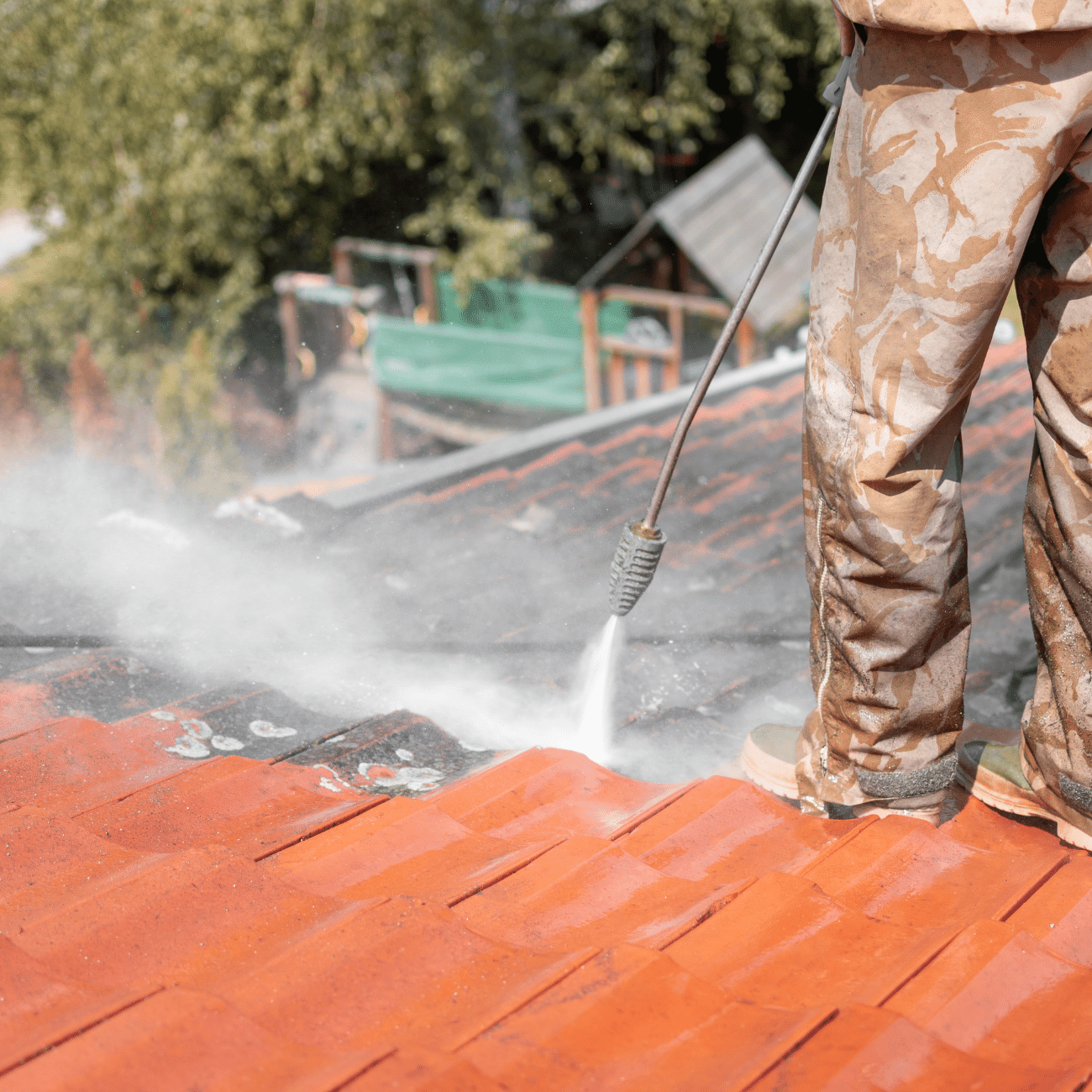 Worker Painting a Tile roof