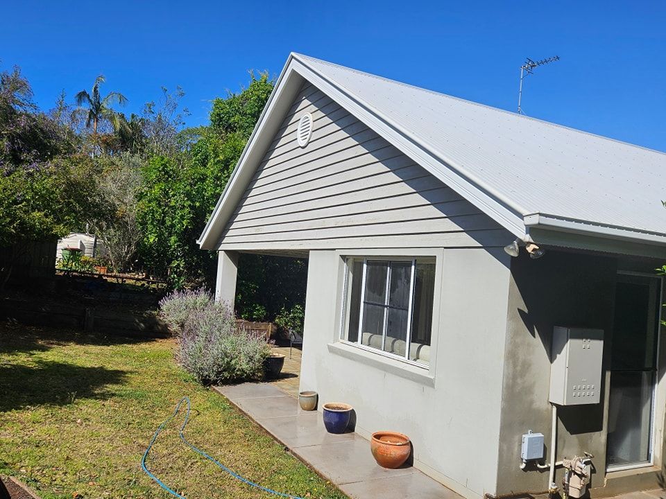 A small white house with a white roof and a lawn in front of it. — O & D House Wash & Cleaning Services in Pittsworth, QLD