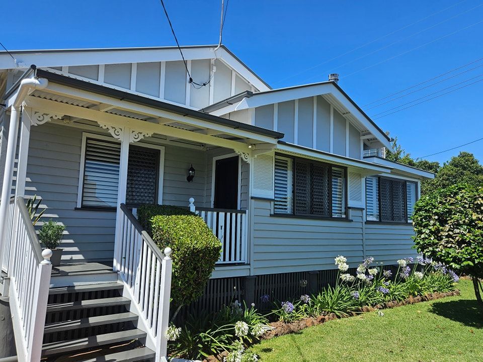 A House With a Porch and Stairs in Front of It — O & D House Wash & Cleaning Services in Highfields, QLD
